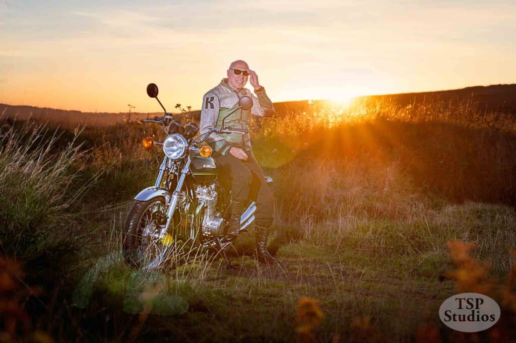 a motorcyclist portrait sat on a kawasaki z 900 during the golden hour